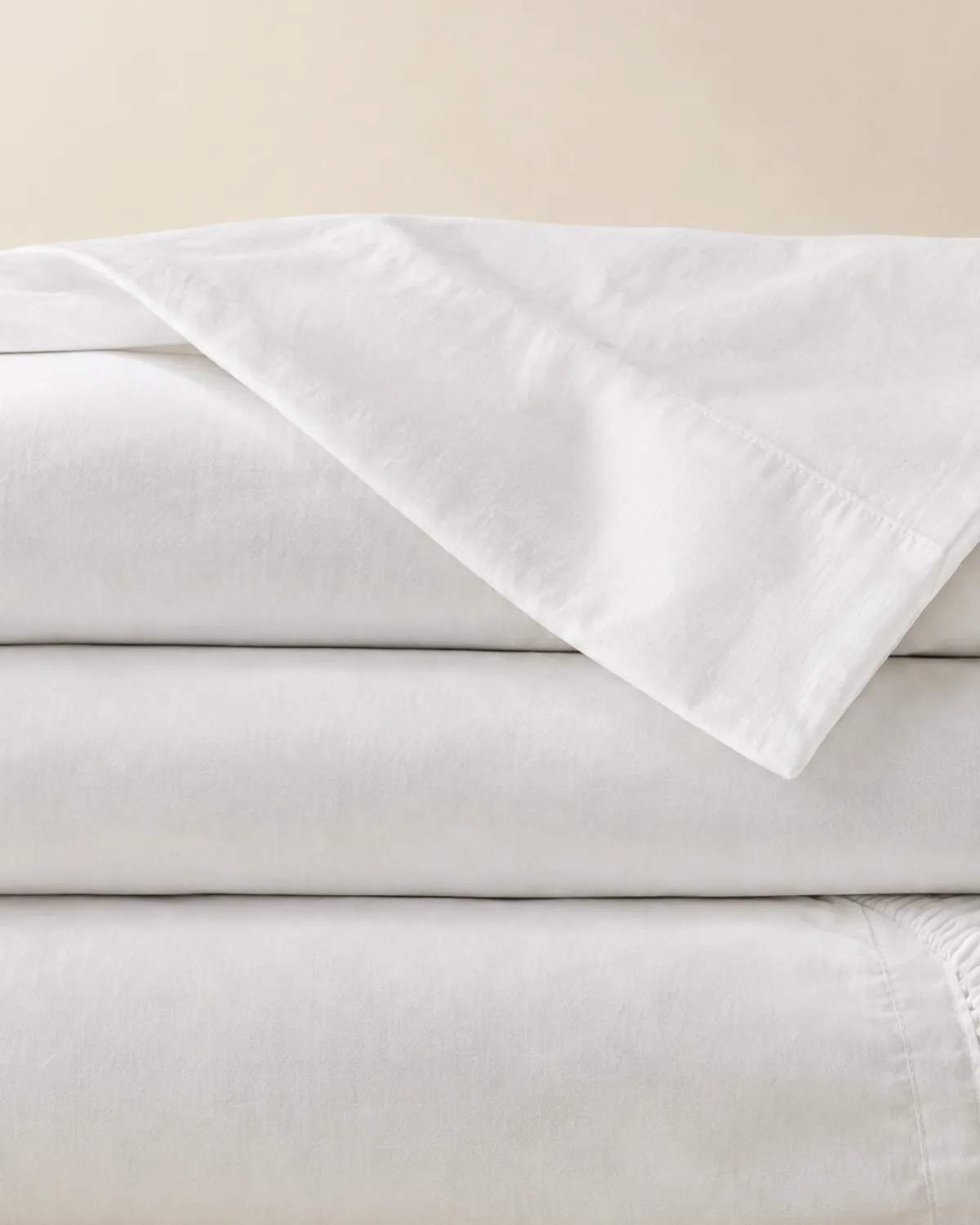 Close-up of folded white 400 thread count percale sheets